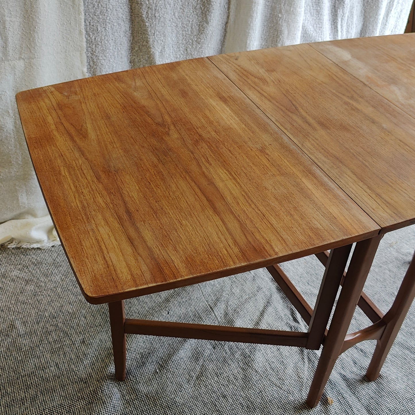 Folding teak dining table