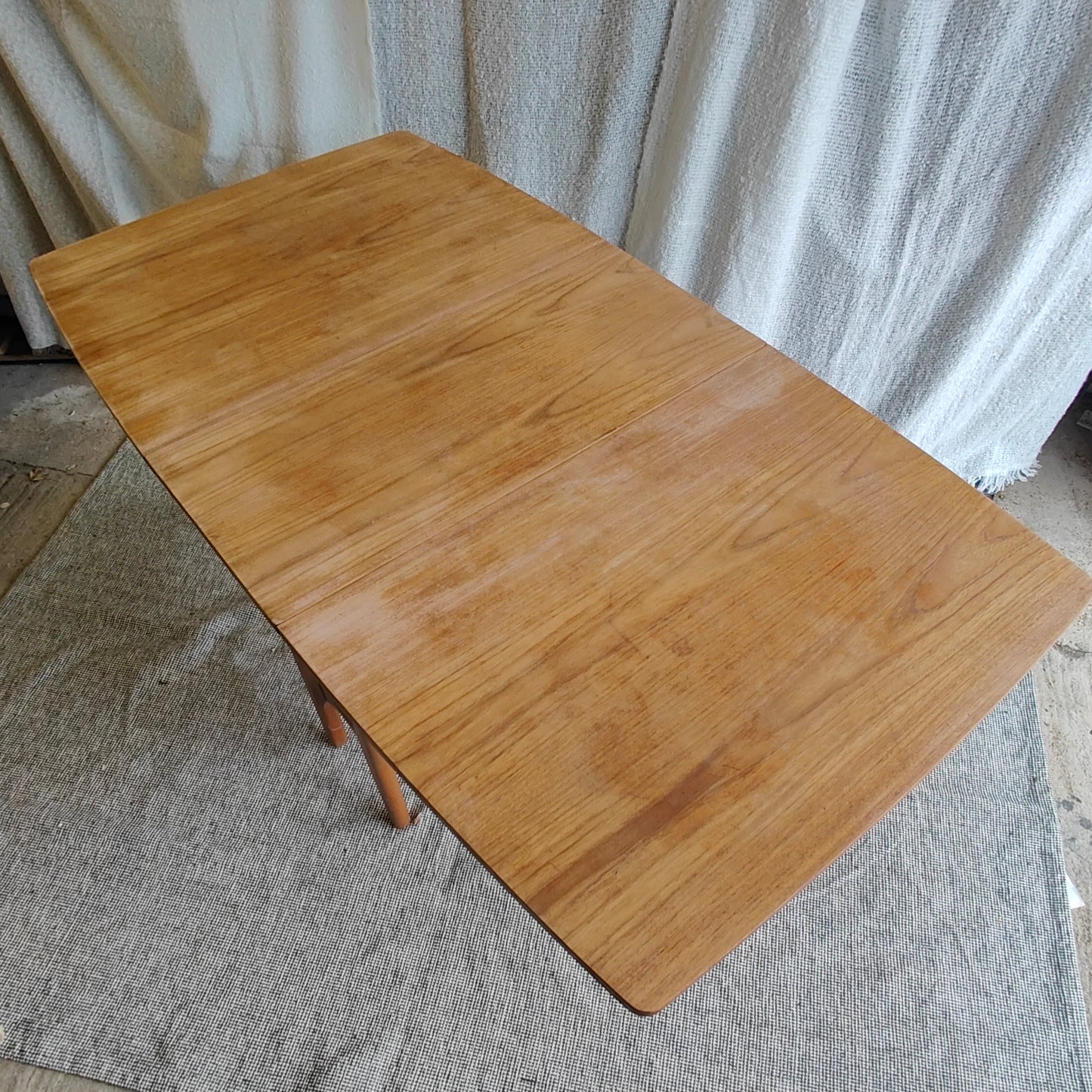 Folding teak dining table
