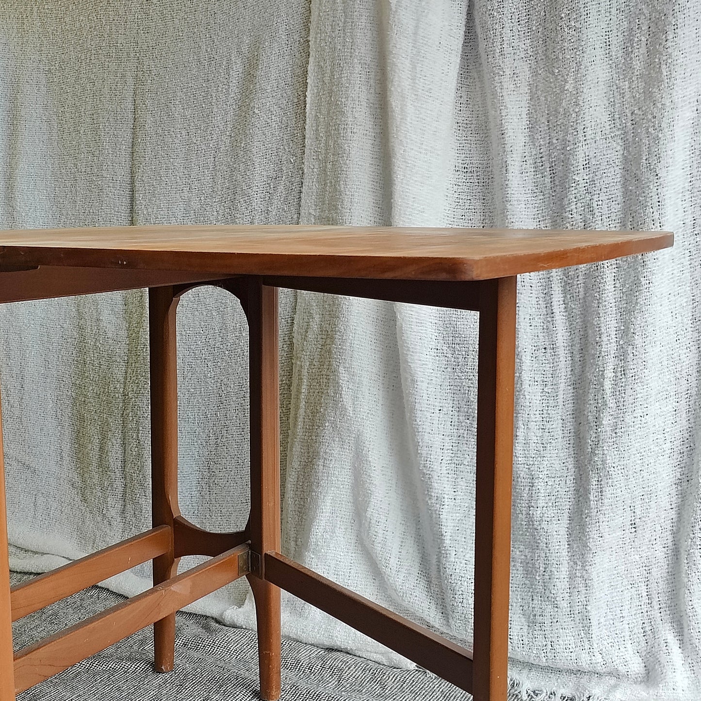 Folding teak dining table